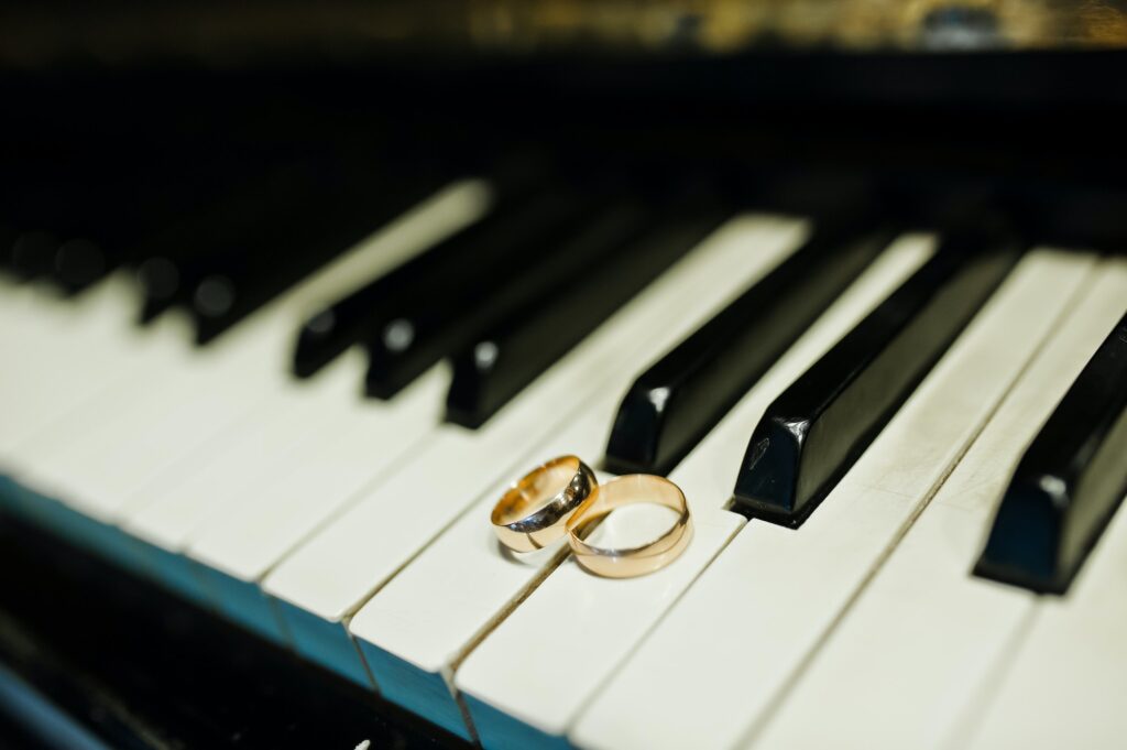 Wedding rings at the piano keys